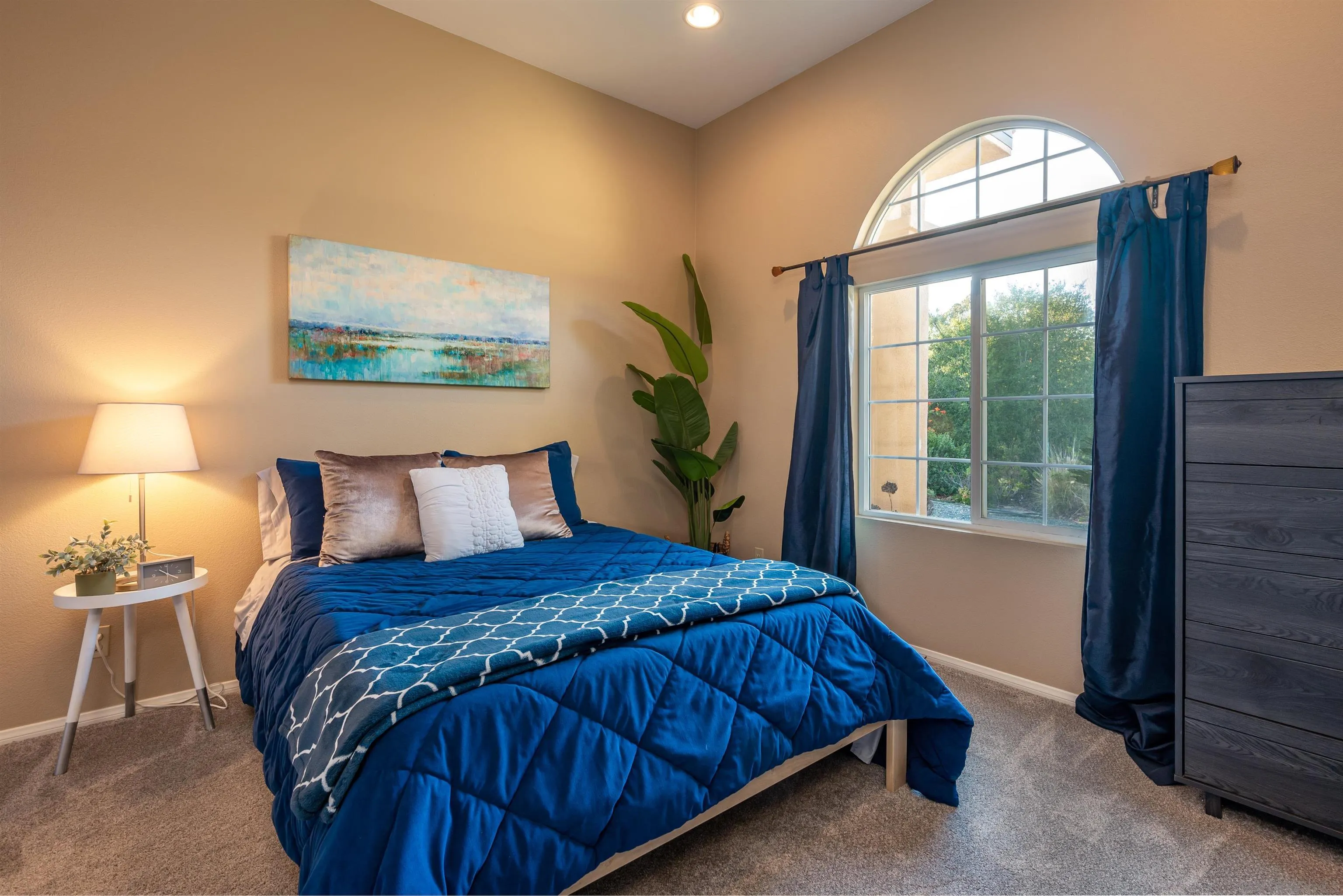 1152 Stoneridge Road El Cajon, CA 92021 - Photo 39 of 71 a bedroom with a bed and a lamp next to a window