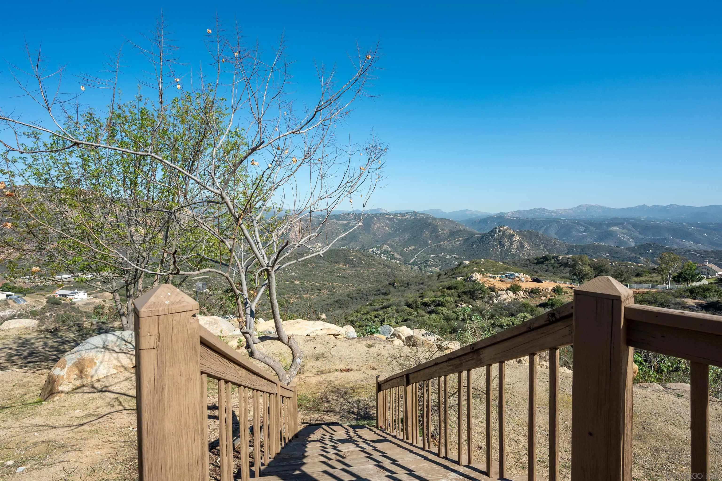 1152 Stoneridge Road El Cajon, CA 92021 - Photo 54 of 71 a view of a balcony with wooden fence and floor