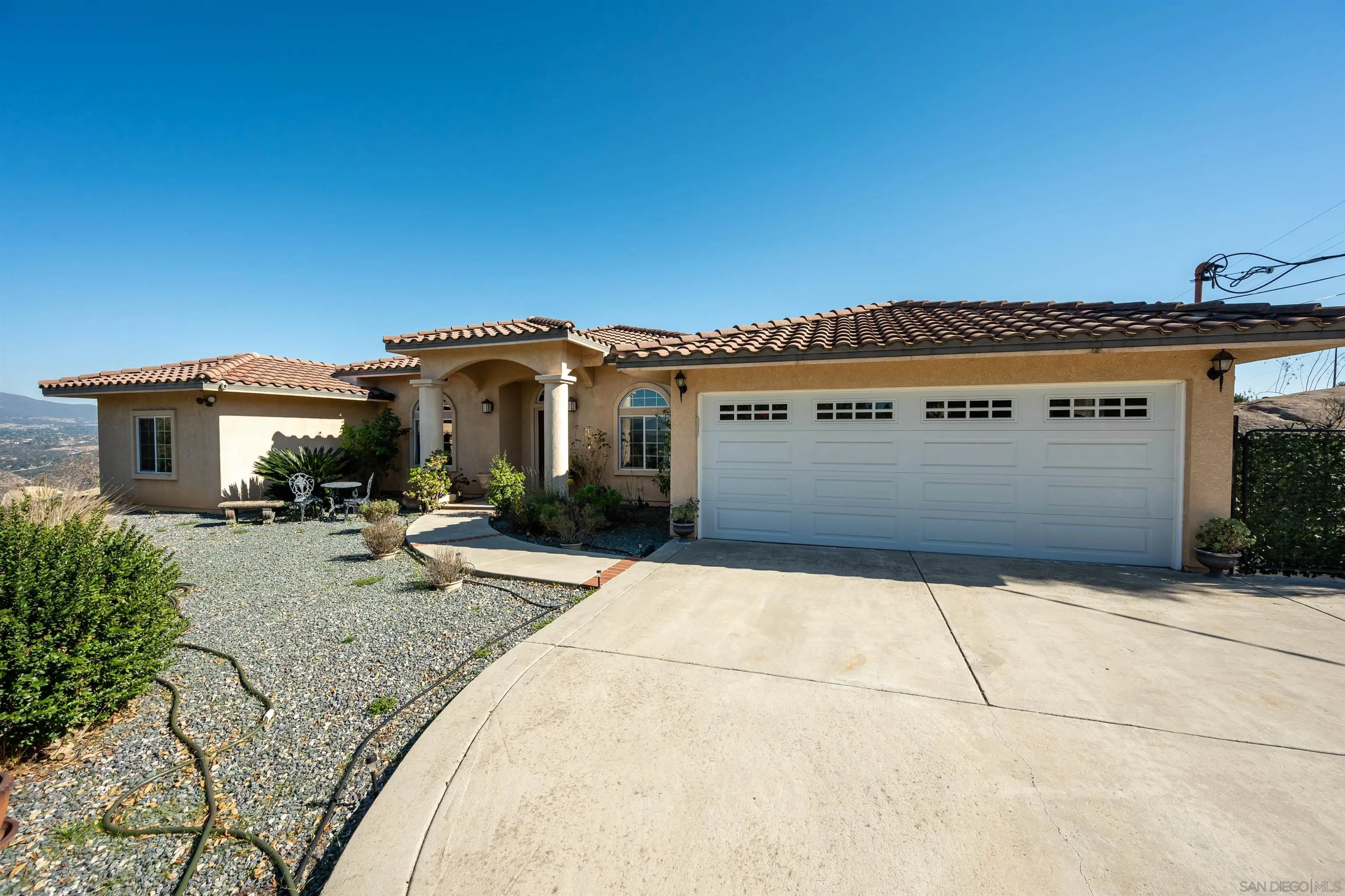 1152 Stoneridge Road El Cajon, CA 92021 - Photo 55 of 71 a front view of a house with a garden