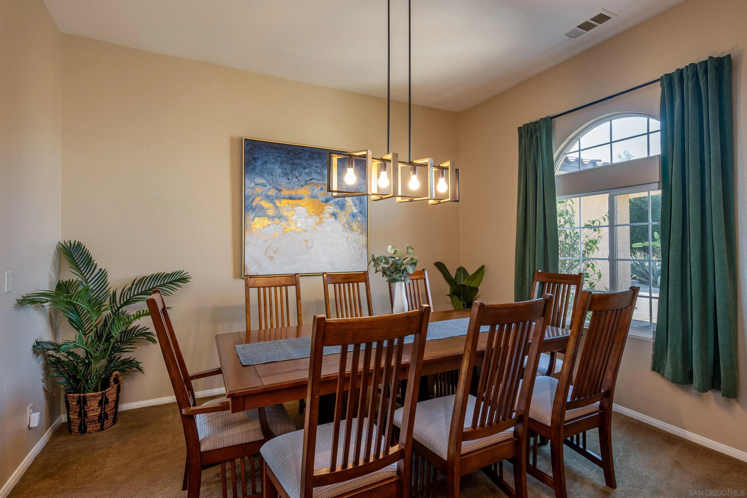 1152 Stoneridge Road El Cajon, CA 92021 - Photo 6 of 71 a view of a dining room with furniture window and wooden floor