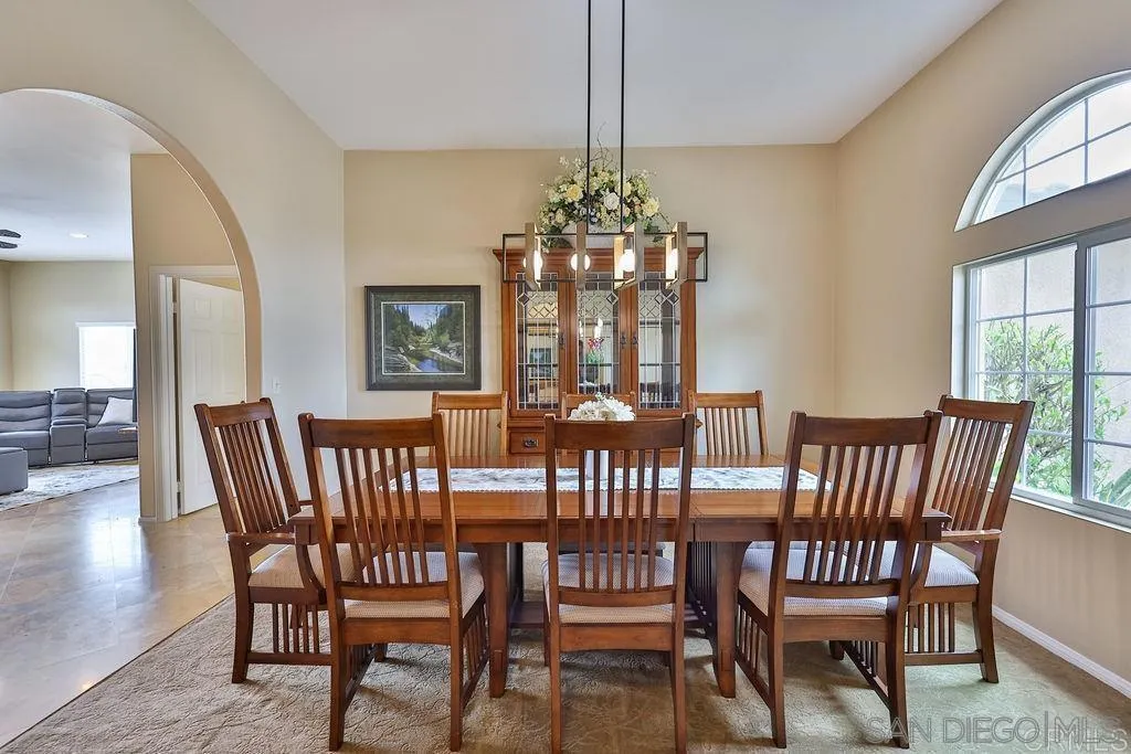 1152 Stoneridge Road El Cajon, CA 92021 - Photo 62 of 71 a view of a dining room with furniture window and wooden floor