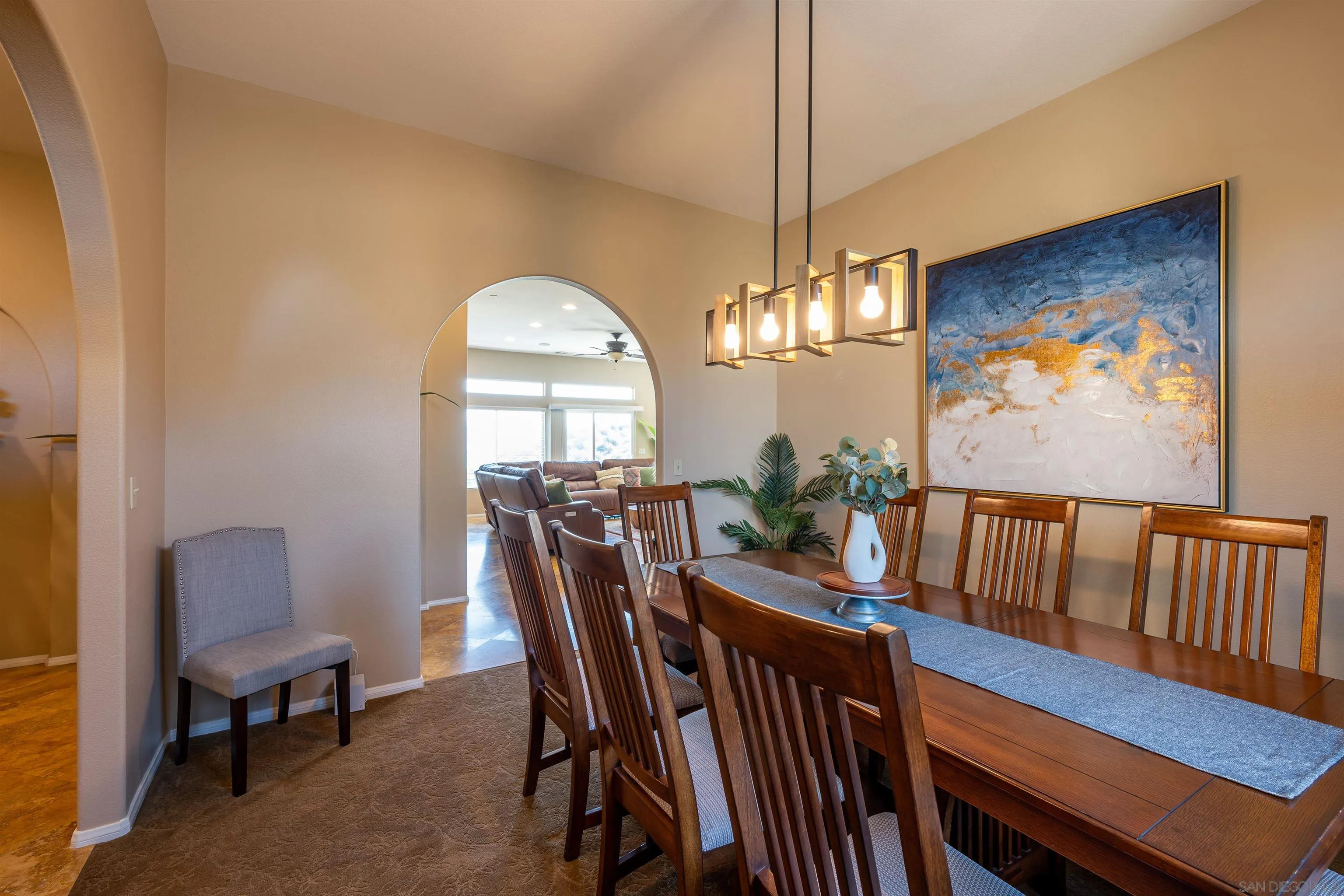 1152 Stoneridge Road El Cajon, CA 92021 - Photo 7 of 71 a view of a dining room with furniture a chandelier and wooden floor