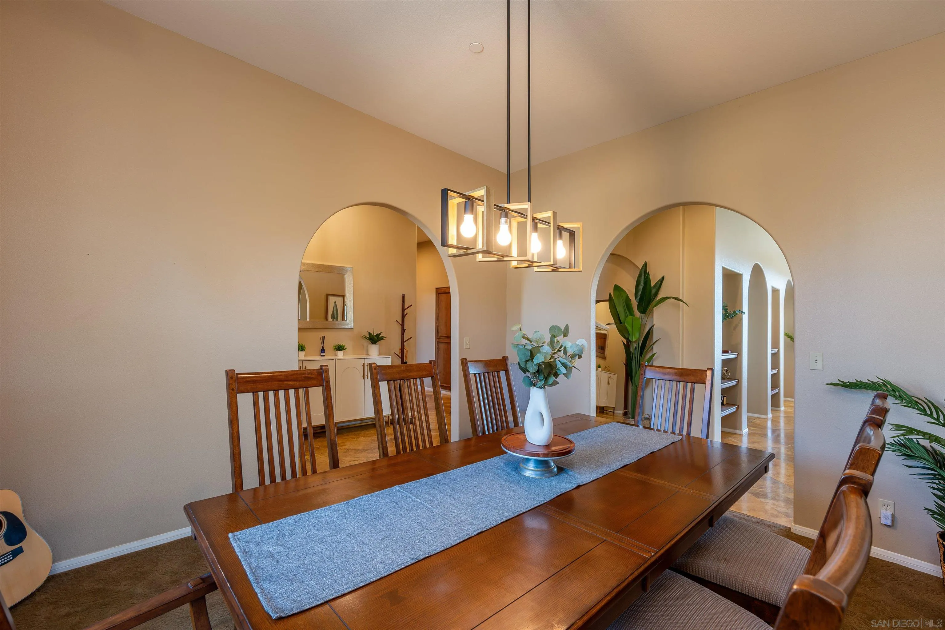 1152 Stoneridge Road El Cajon, CA 92021 - Photo 8 of 71 a view of a dining room with furniture a chandelier and wooden floor