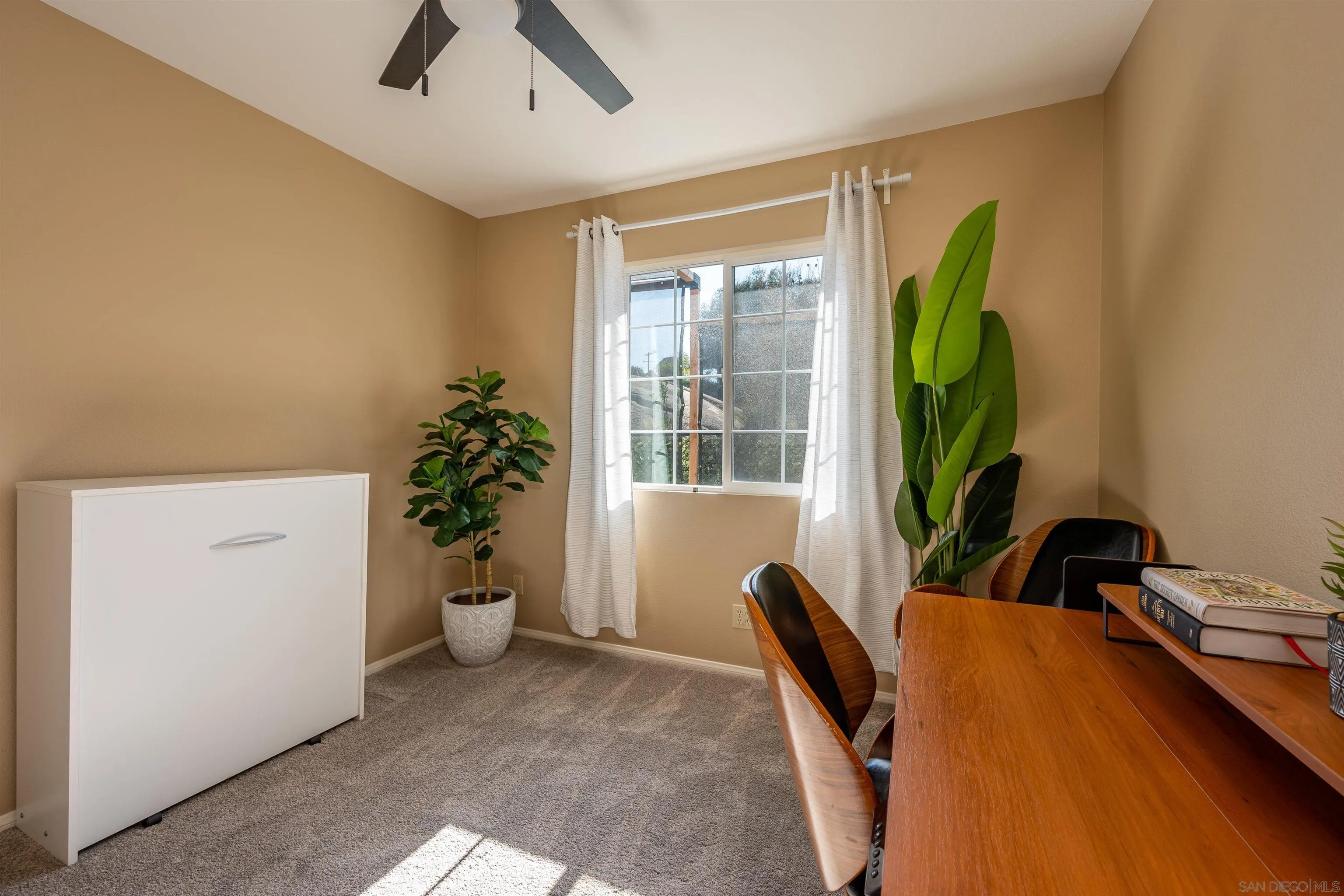 1152 Stoneridge Road El Cajon, CA 92021 - Photo 10 of 71 a living room with furniture and a potted plant