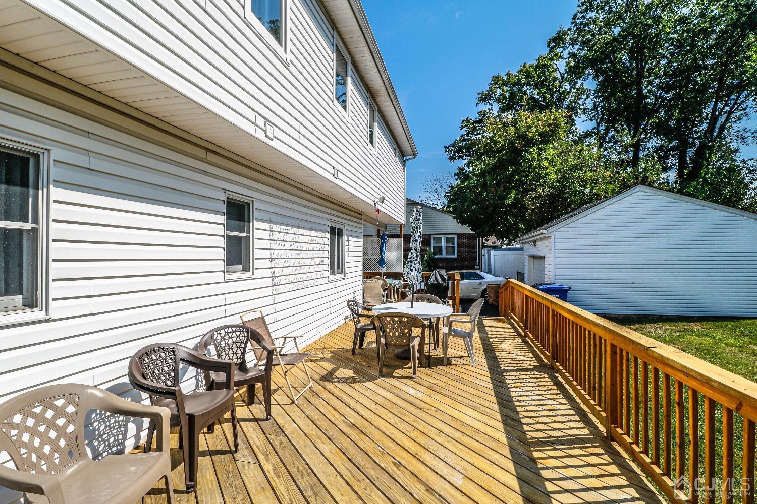 67 Normandy Road Colonia, NJ 07067 - Photo 3 of 28 Huge deck runs across the entire length of the back of this lovely well maintained home.