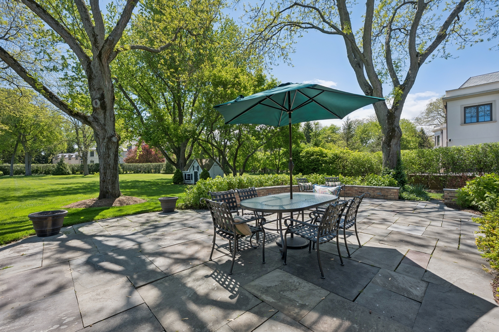 936 Sunset Road Winnetka, IL 60093 - Photo 45 of 50 a view of a table and chairs under an umbrella