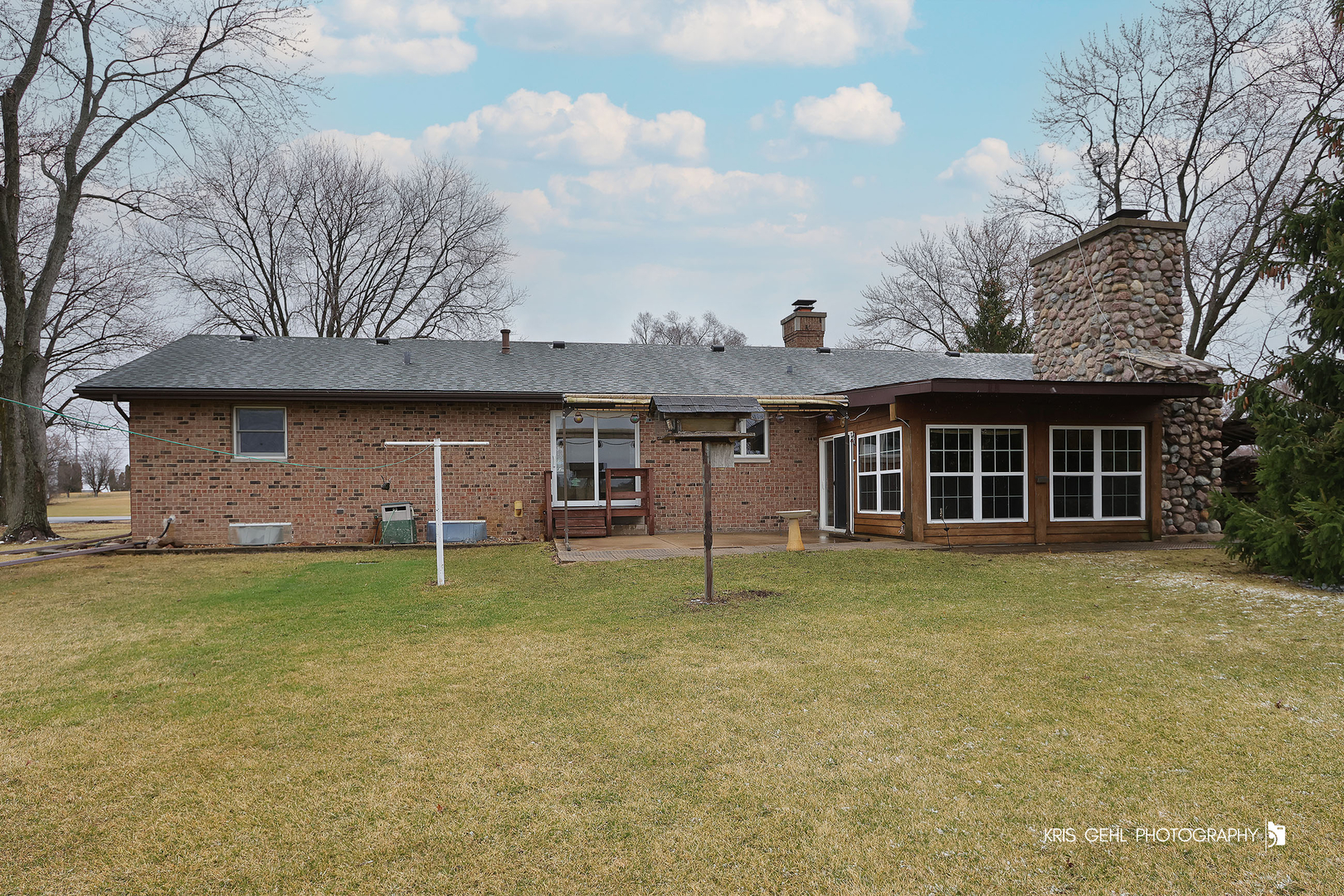 3409 Chukar Road Woodstock, IL 60098 - Photo 12 of 15 a front view of a house with a garden