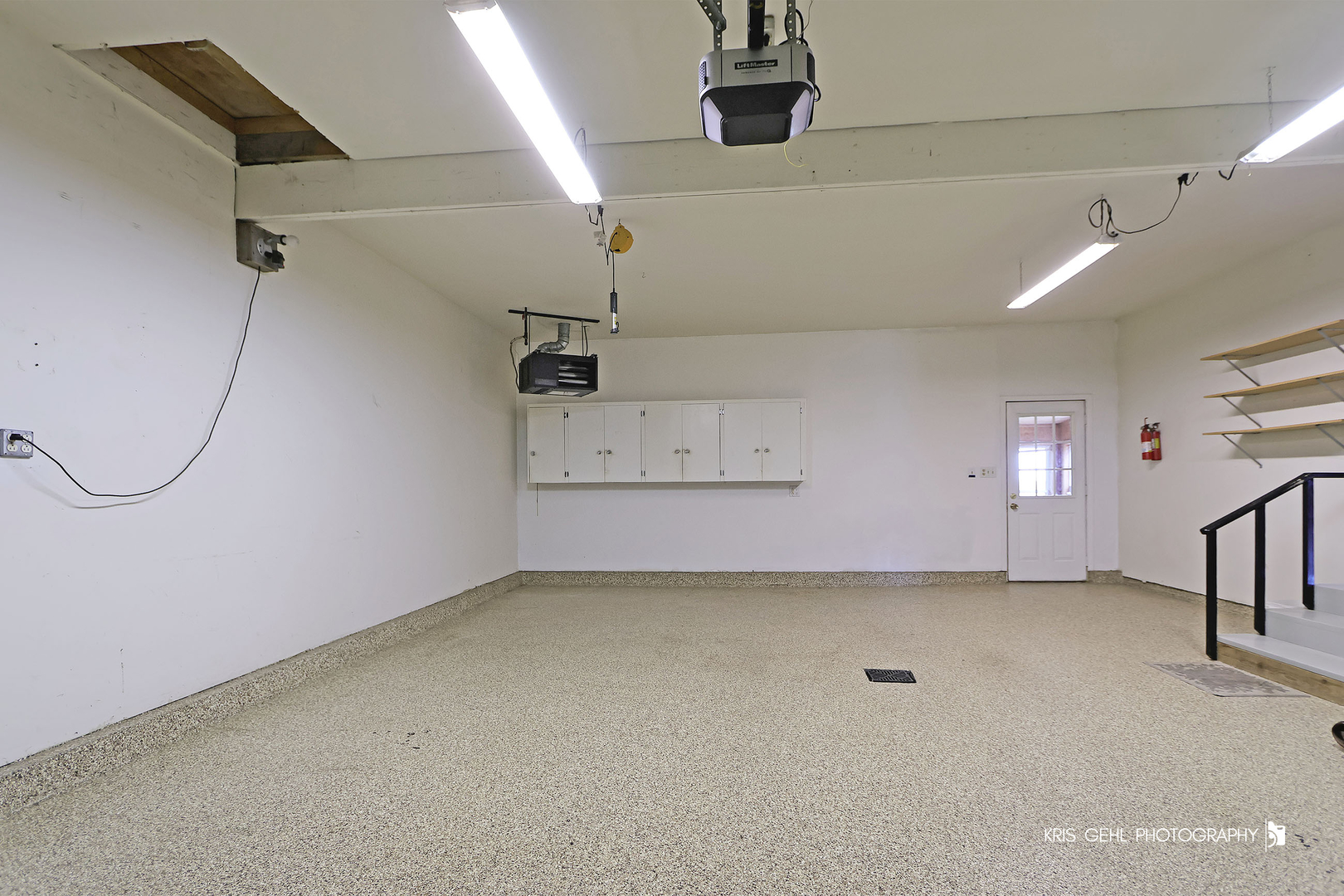 3409 Chukar Road Woodstock, IL 60098 - Photo 6 of 15 an empty room with staircase and windows