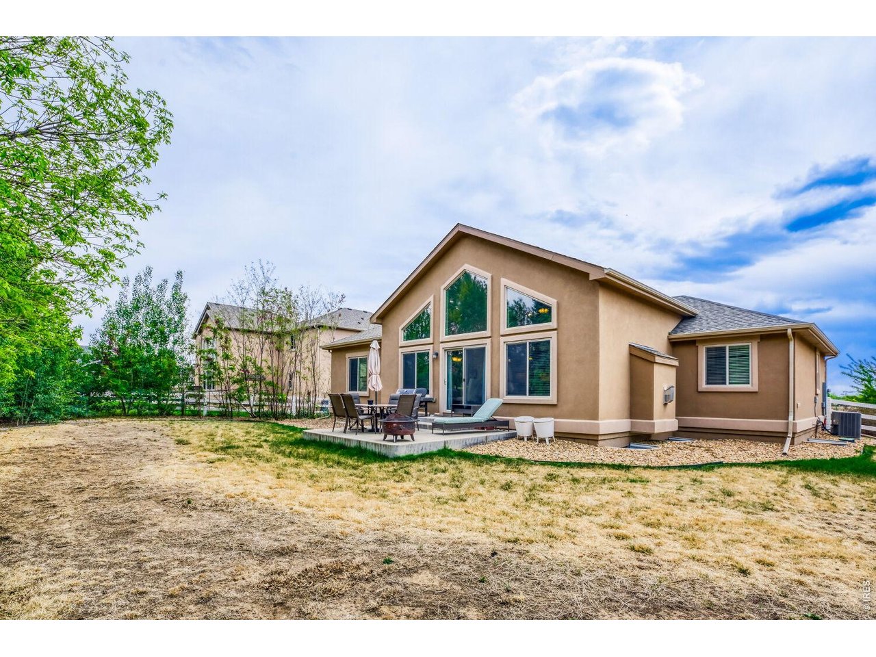 7992 St Street Frederick, CO 80530 - Photo 25 of 28 a front view of a house with garden