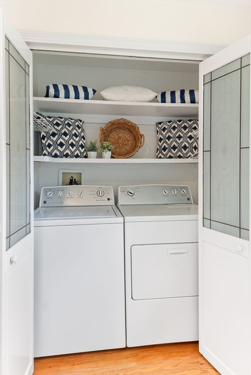17 Weaver Street Wareham, MA 02576 - Photo 13 of 37 a view of washer and dryer with white cabinets