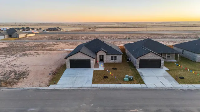 an aerial view of a house with a outdoor space