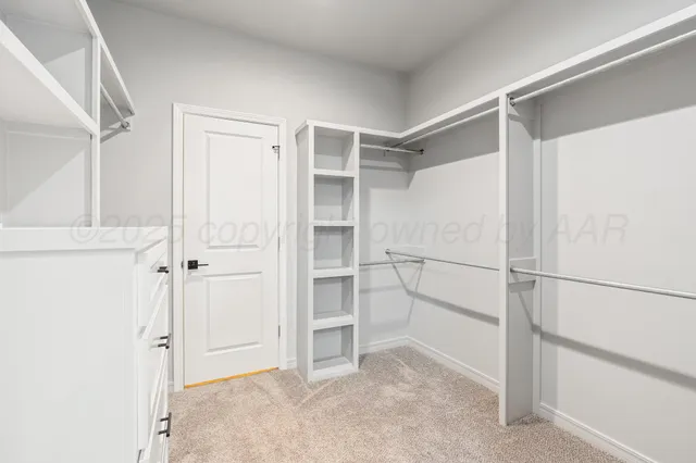 a view of an empty walk in closet