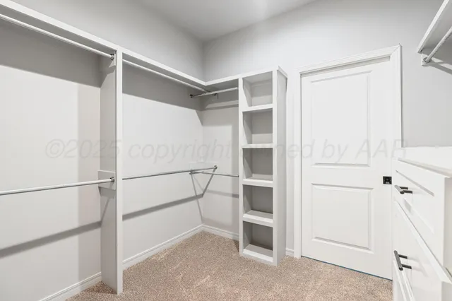 a view of an empty walk in closet