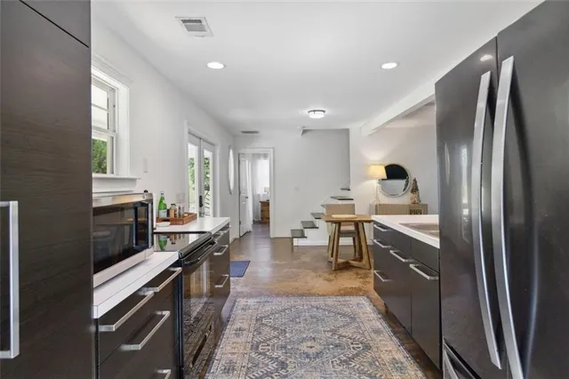 a kitchen with a stove and a sink
