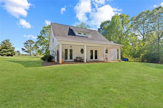 a view of a grassy field with trees