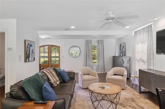 a large kitchen with kitchen island a sink stainless steel appliances and cabinets