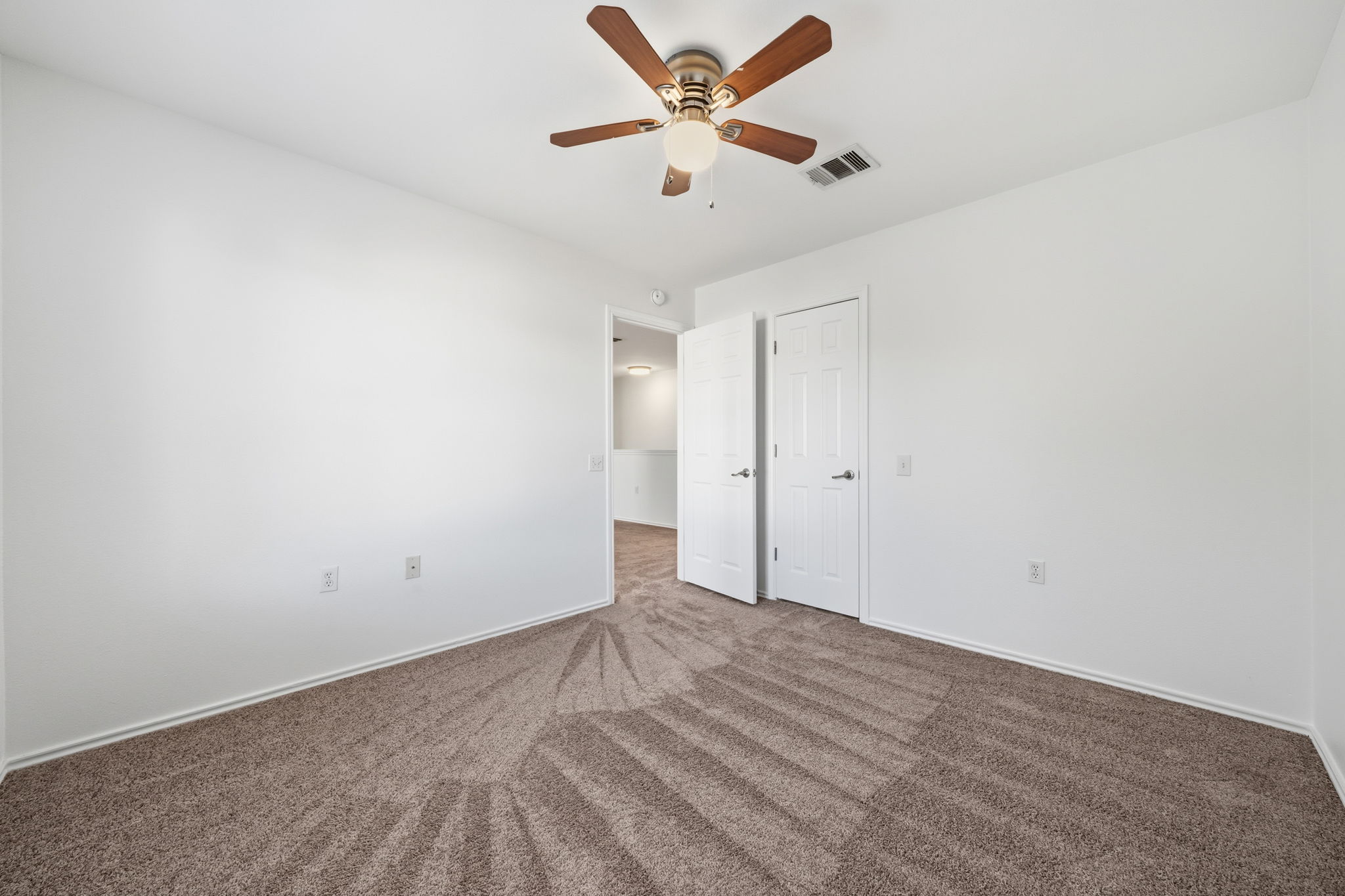 5712 Zachary Scott Street Austin, TX 78747 - Photo 20 of 28 Spare room with carpet floors and a ceiling fan