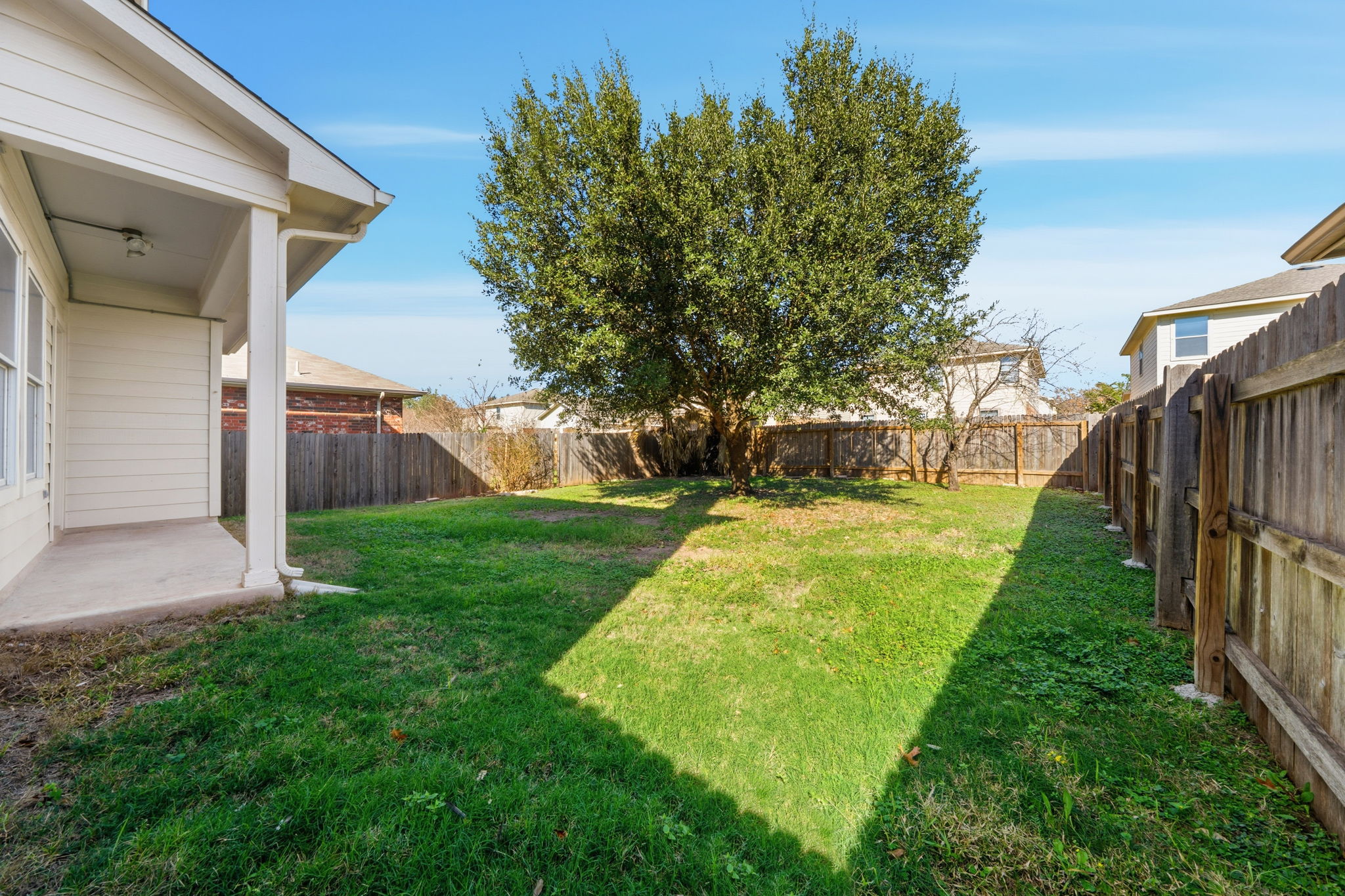 5712 Zachary Scott Street Austin, TX 78747 - Photo 27 of 28 Fenced backyard with a patio area