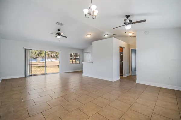 a view of a kitchen with a sink and a window