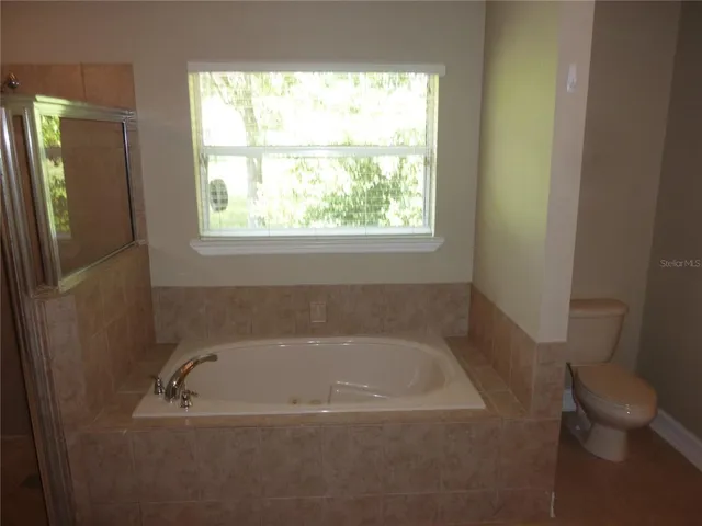 a bath tub sitting next to a window