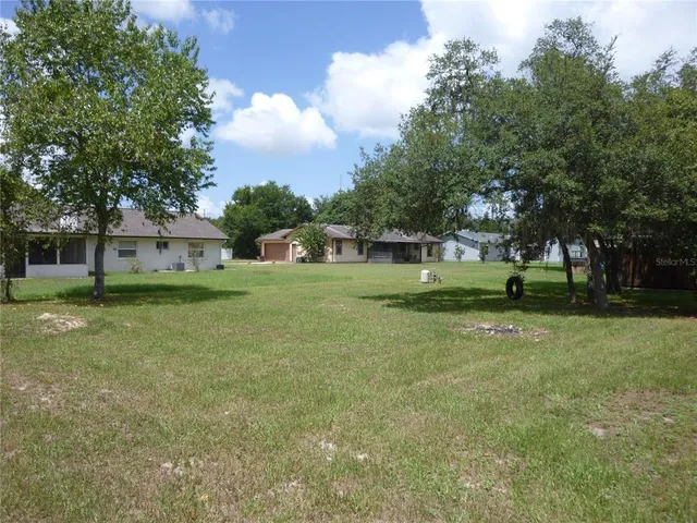 a view of a house with a big yard