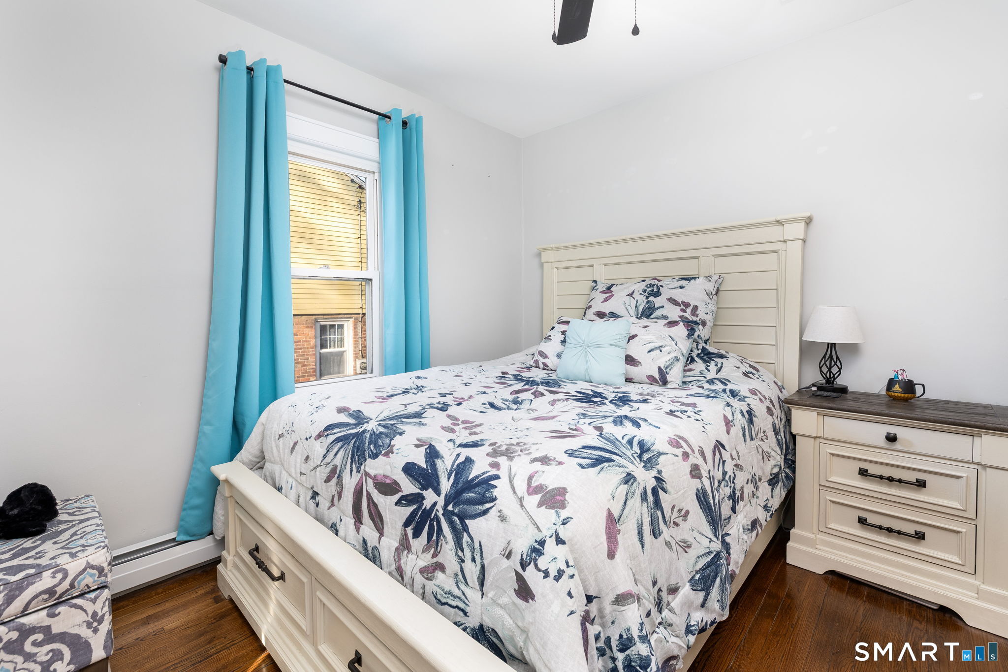 681 Main Street Cromwell, CT 06416 - Photo 17 of 39 a bed sitting in a bedroom next to a window