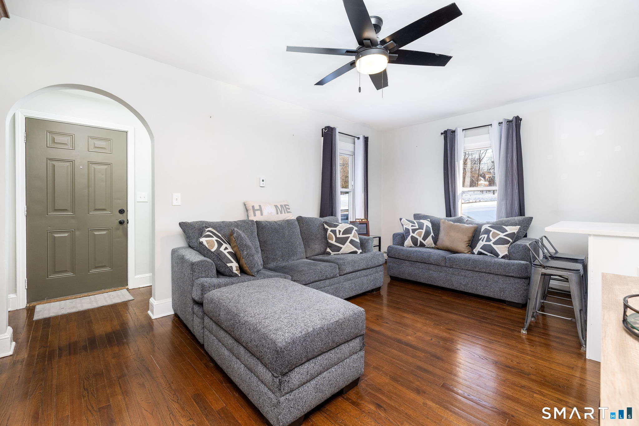 681 Main Street Cromwell, CT 06416 - Photo 2 of 39 a living room with furniture and a wooden floor
