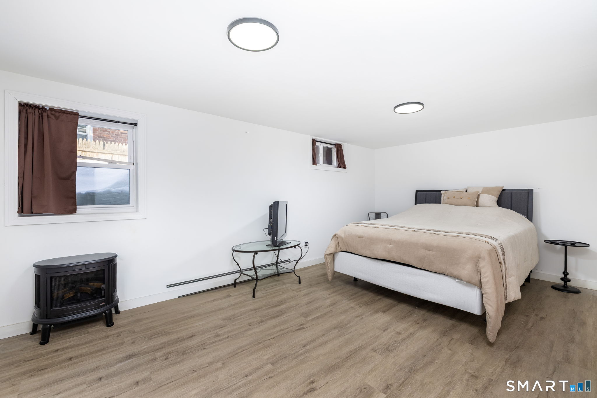 681 Main Street Cromwell, CT 06416 - Photo 26 of 39 a bedroom with a bed and wooden floor