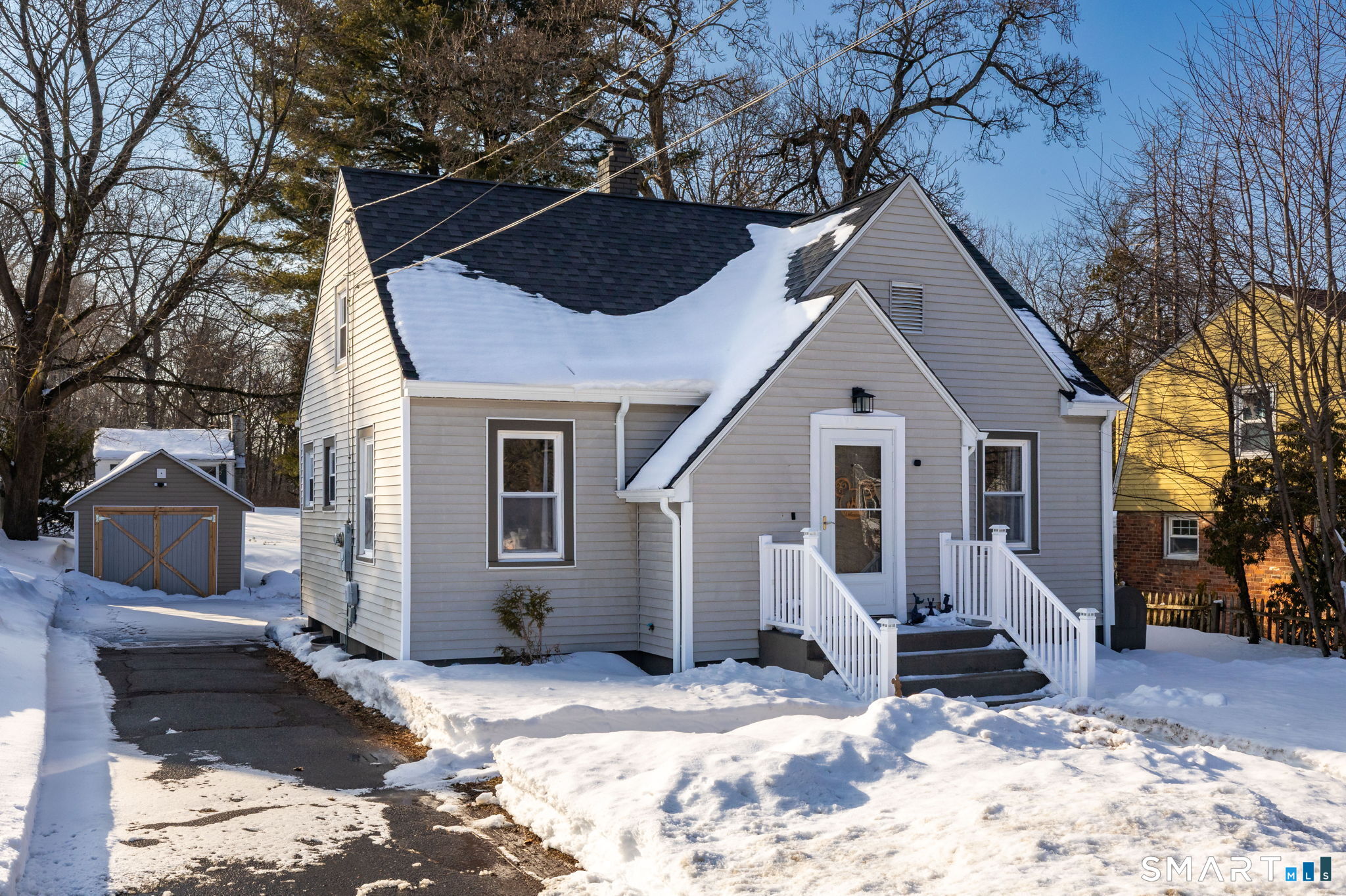 681 Main Street Cromwell, CT 06416 - Photo 29 of 39 a view of a house with a yard and wooden fence