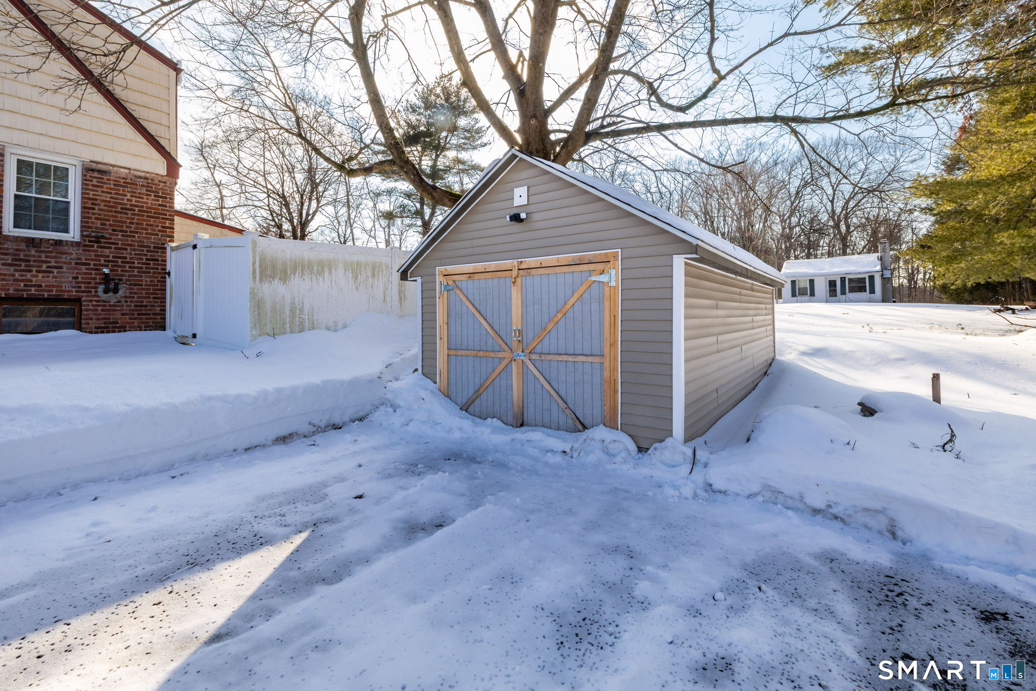 681 Main Street Cromwell, CT 06416 - Photo 30 of 39 a view of a house with a snow in the yard