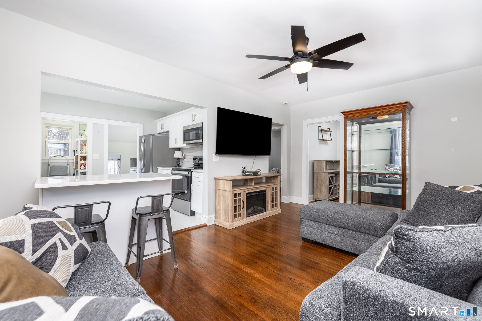 681 Main Street Cromwell, CT 06416 - Photo 38 of 39 a living room with furniture and a flat screen tv