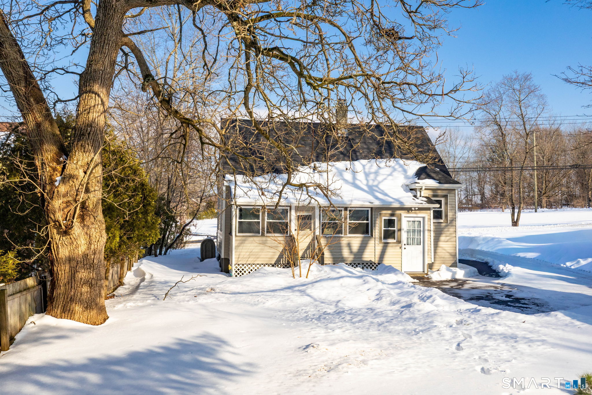 681 Main Street Cromwell, CT 06416 - Photo 8 of 39 a view of a house with snow on the road