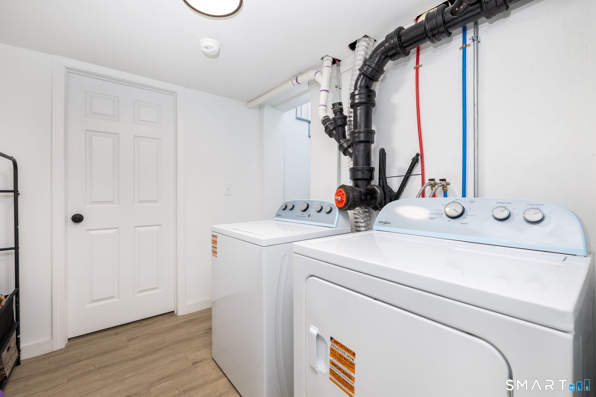 681 Main Street Cromwell, CT 06416 - Photo 9 of 39 a bathroom with a sink and a mirror