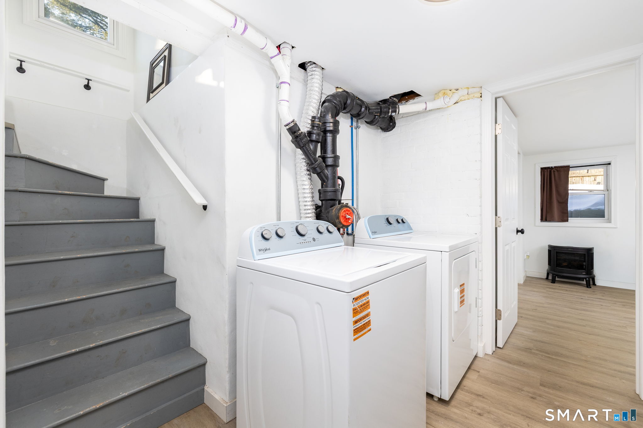 681 Main Street Cromwell, CT 06416 - Photo 10 of 39 a utility room with closet dryer and stair