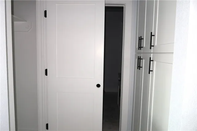a view of a hallway with closet