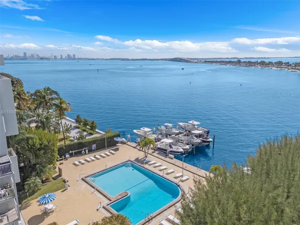 an aerial view of a house with a lake view