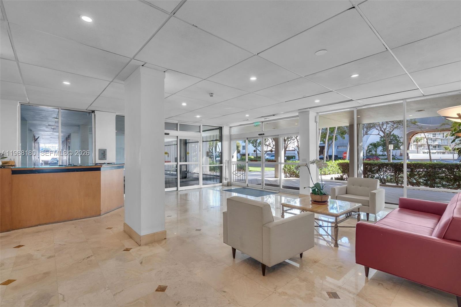 150 Southeast 25th Road, Unit 8H Miami, FL 33129 - Photo 14 of 41 a living room with furniture a lamp and a large window