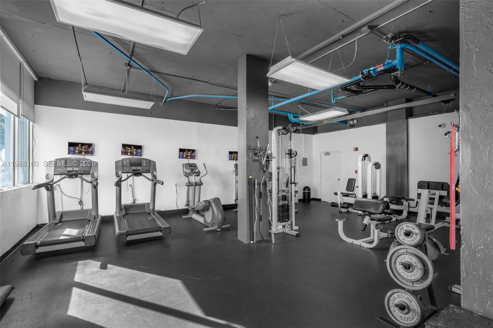 150 Southeast 25th Road, Unit 8H Miami, FL 33129 - Photo 15 of 41 a view of a room with gym equipment