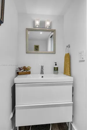 a bathroom with a sink and a mirror