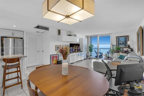 a kitchen with a counter top space and furniture