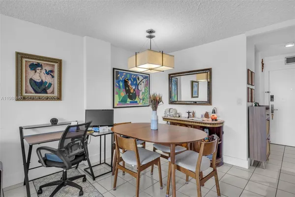 a kitchen with stainless steel appliances granite countertop a refrigerator stove microwave and cabinets