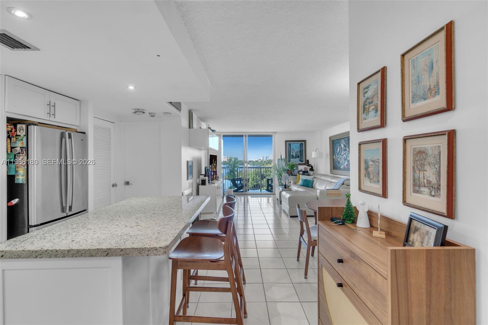 150 Southeast 25th Road, Unit 8H Miami, FL 33129 - Photo 39 of 41 a living room with stainless steel appliances kitchen island granite countertop furniture and a kitchen view