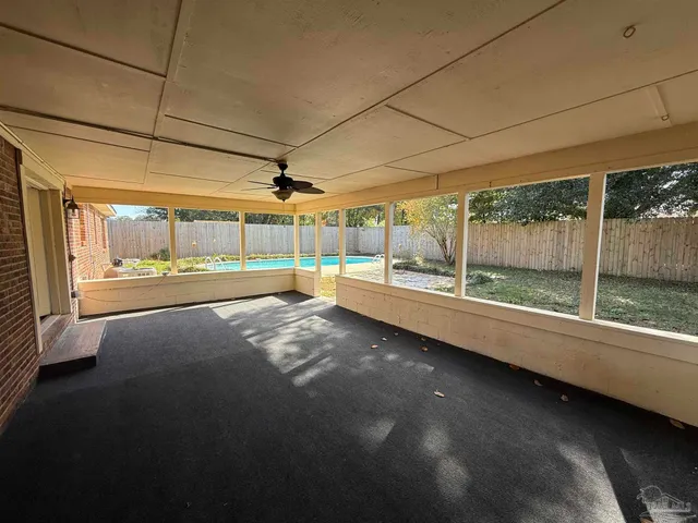 a view of a room with porch and wooden floor