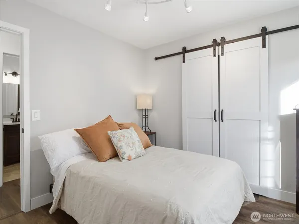 a bedroom with a bed and a shower