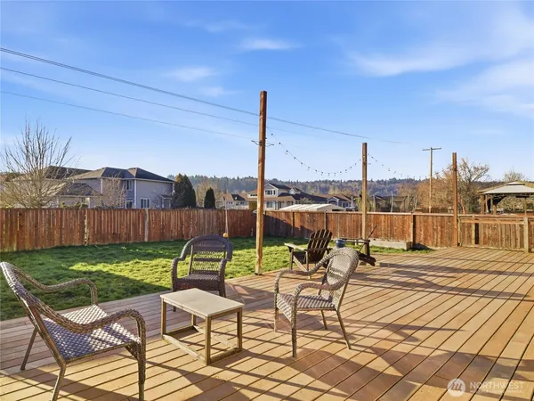 a view of a chairs and table in patio