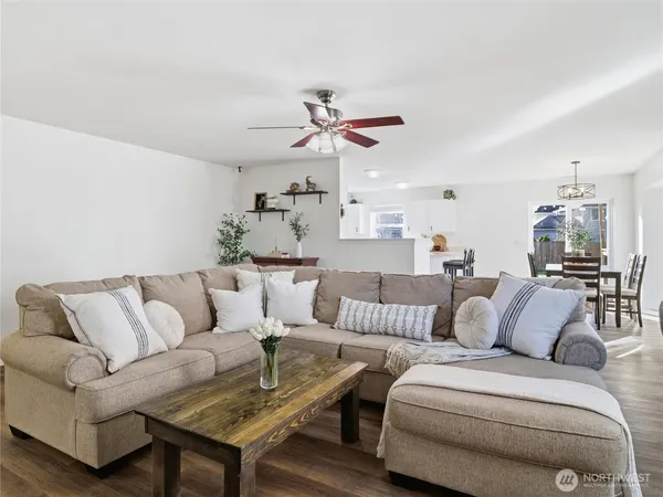 a living room with furniture or couch and a chandelier