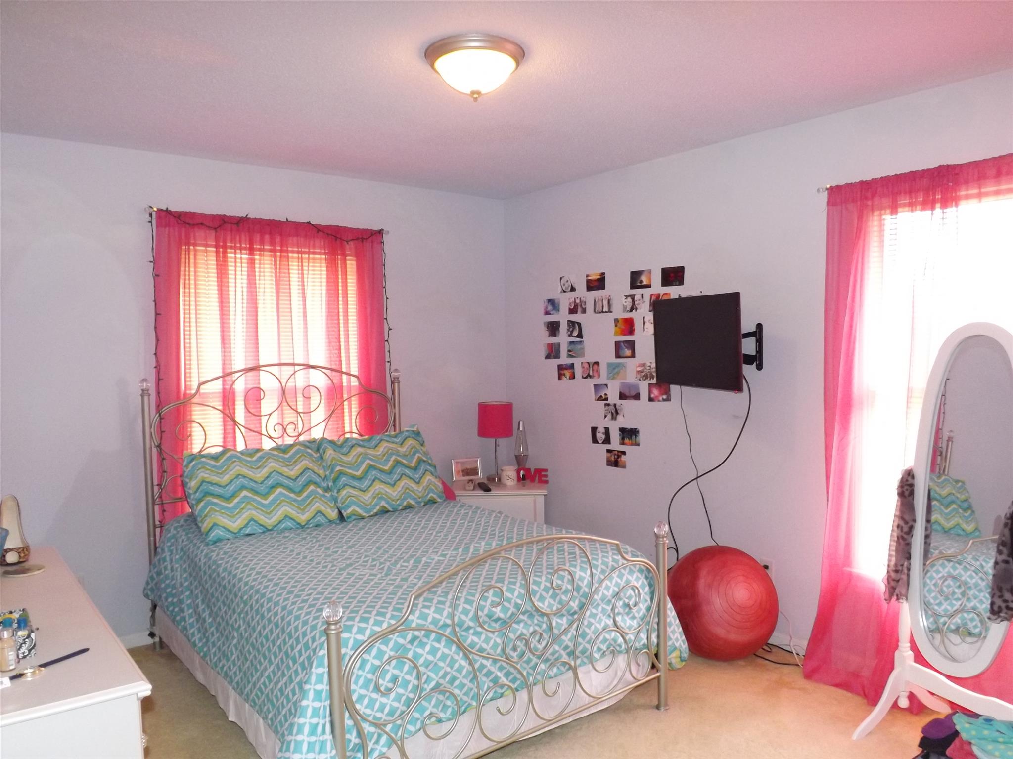 1600 Mud Creek Road Morrison, TN 37357 - Photo 22 of 28 a bedroom with a bed and a chandelier