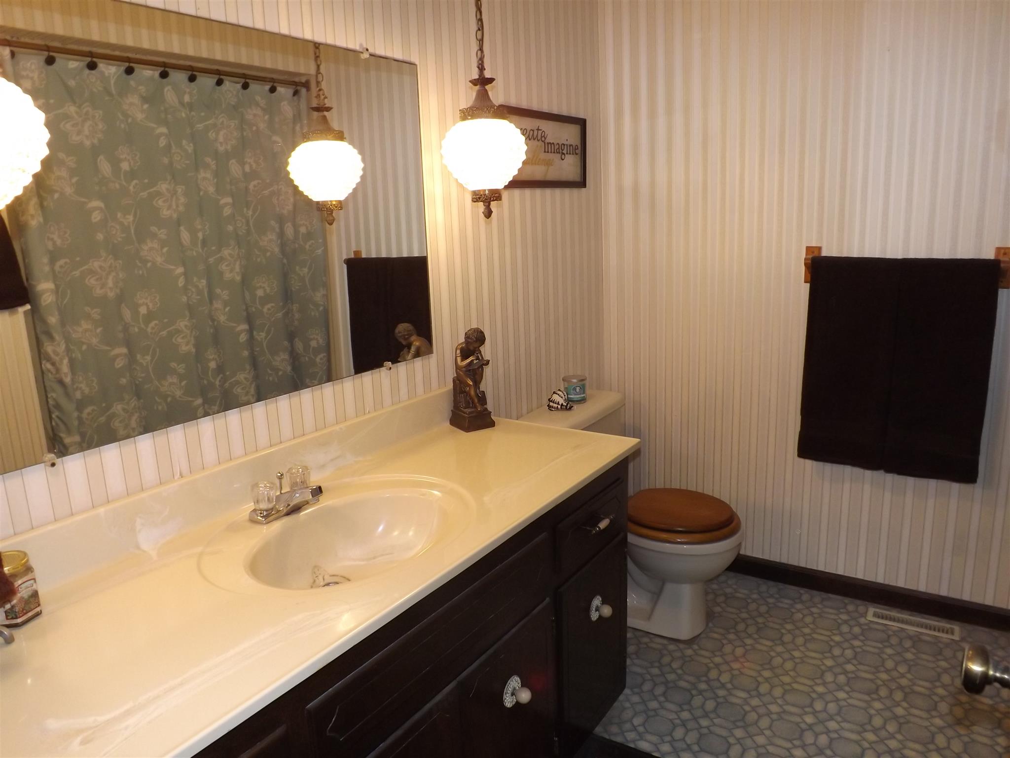 1600 Mud Creek Road Morrison, TN 37357 - Photo 24 of 28 a bathroom with a sink and a mirror