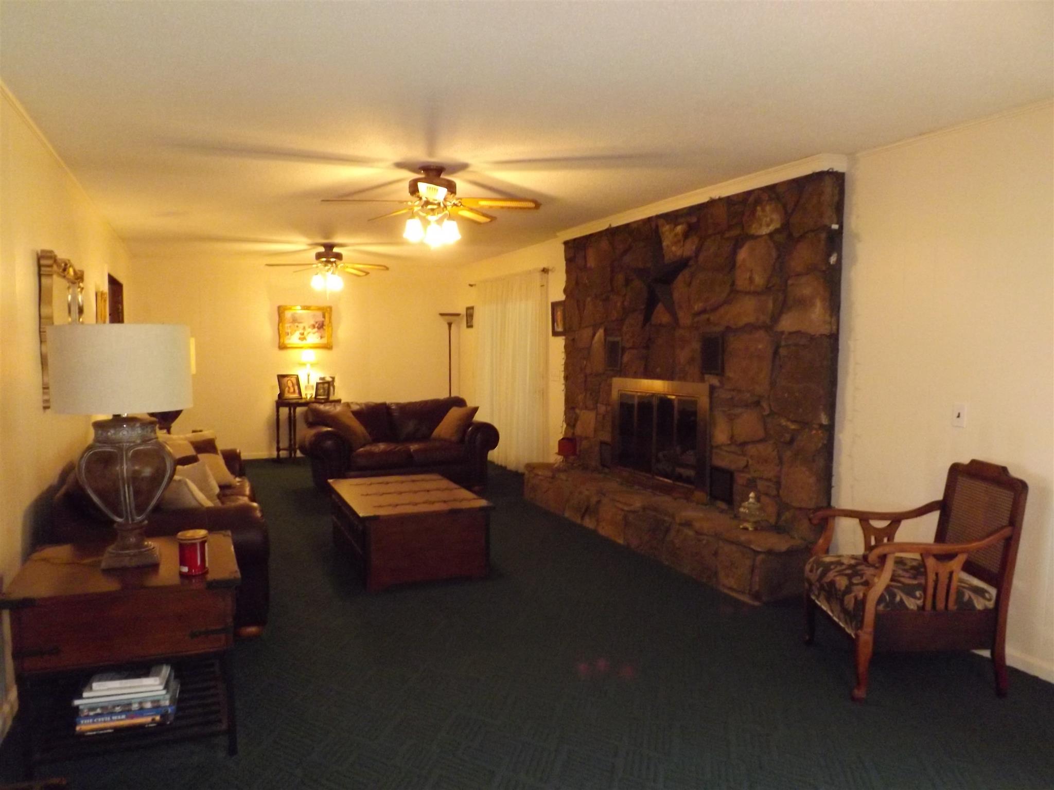 1600 Mud Creek Road Morrison, TN 37357 - Photo 10 of 28 a living room with furniture and a lamp