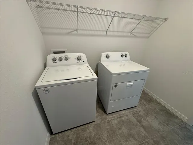 an empty room with a empty space and windows